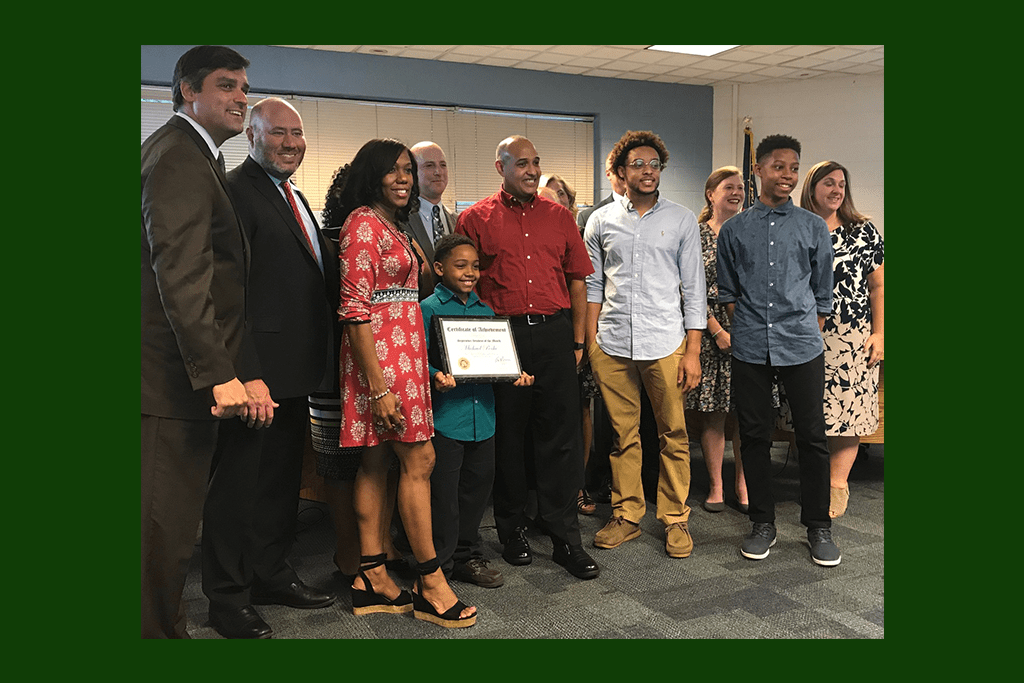 Student of the month Michael Poche and his family were recognized by the board. (photo by Rebecca Gaunt)