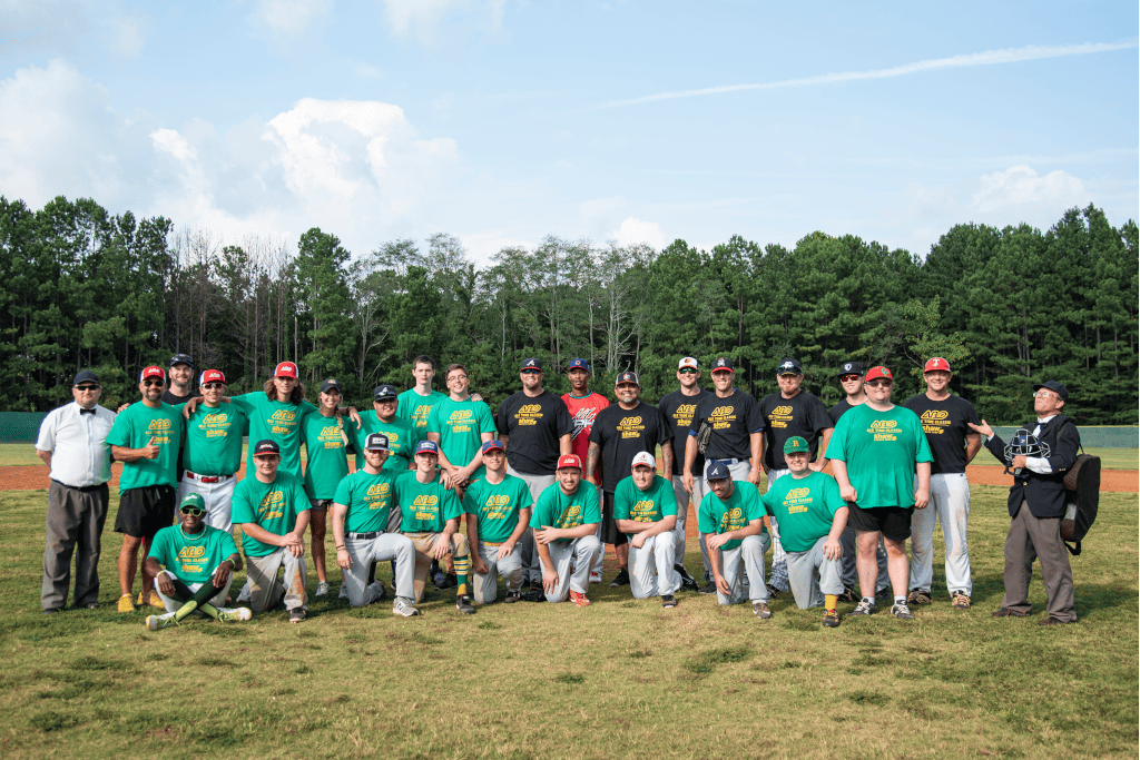 team photo of tow rows of people in baseball uniforms