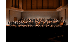 Georgia Symphony Music Director and Conductor Timothy Verville (standing, foreground) will lead the orchestra’s May 21, 2022, season finale performance at KSU’s Bailey Performance Center.