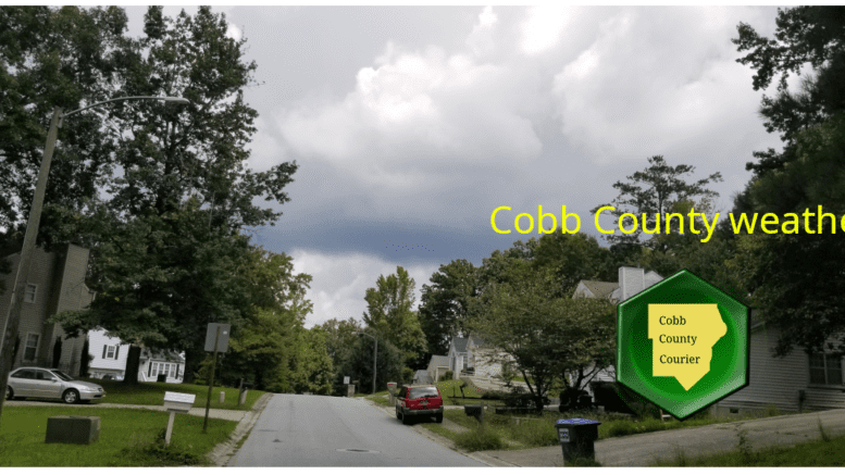 Cobb weather July 24: Photo of cloudy skies above a residential street
