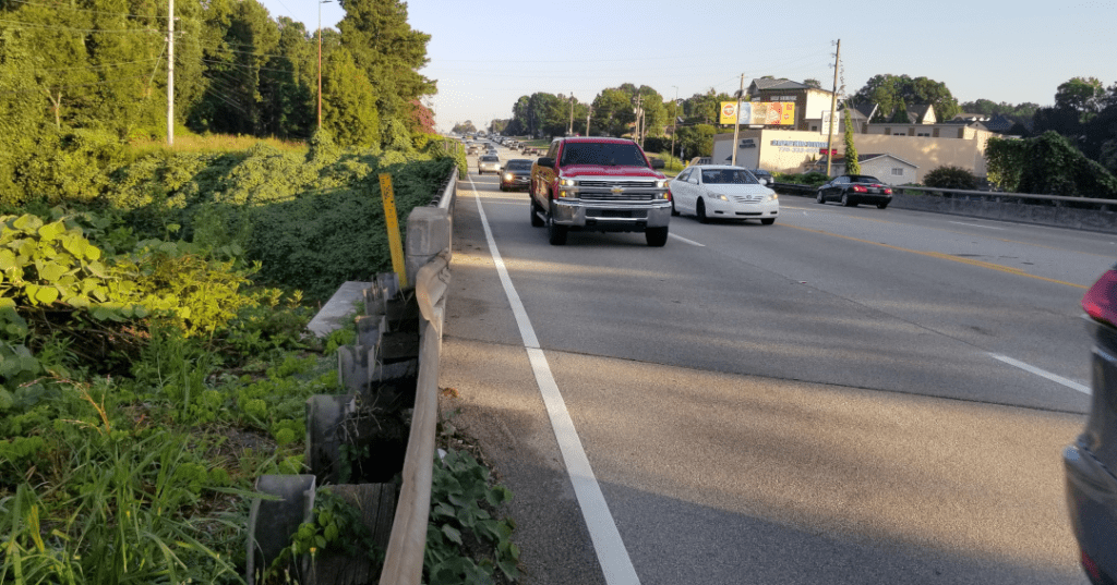 South Cobb Drive from a narrow shoulder facing oncoming traffic