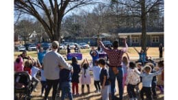 Adults with children outdoors at the Cobb Collaborative Resiliency Week event