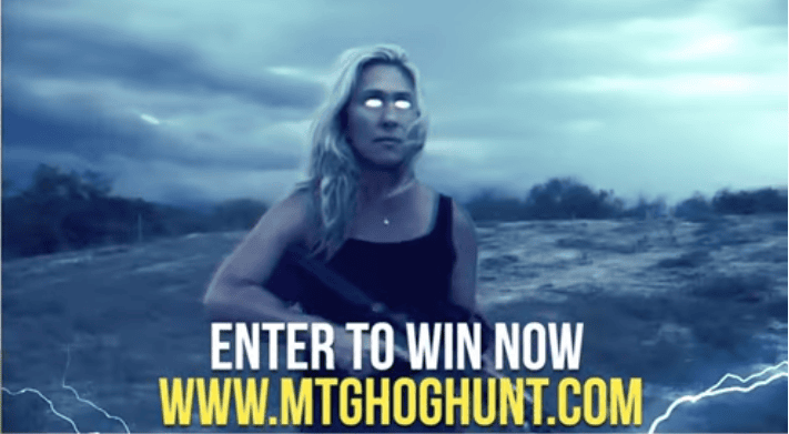 In a recent campaign video, Marjorie Taylor Greene grabbed a rifle and climbed aboard a waiting helicopter, where she tracked down and shot a fleeing hog. Video screenshot