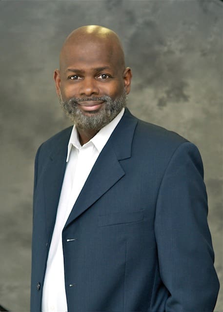 Jon Bothers (blue jacket, no tie)