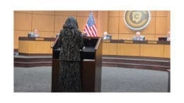 Public commenter at the microphone facing the Cobb County Board of Education
