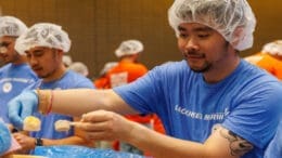 A Lockheed Martin Marietta employee measures ingredients for a pack of Apple Cinnamon Oatmeal. Sixty employees from the company helped pack 565,380 meals for Atlanta families facing food insecurities, as part of a 9/11 Day of Service community support event on September 11, 2026. (Lockheed Martin photo by Thinh D. Nguyen)